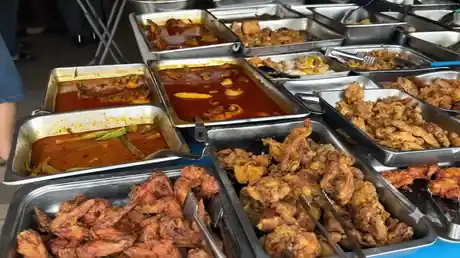 Trays of freshly cooked dishes at the Jiak Baba kitchen